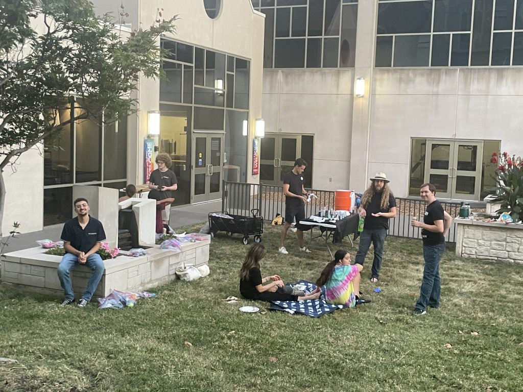 A gathering of young people outside a university building